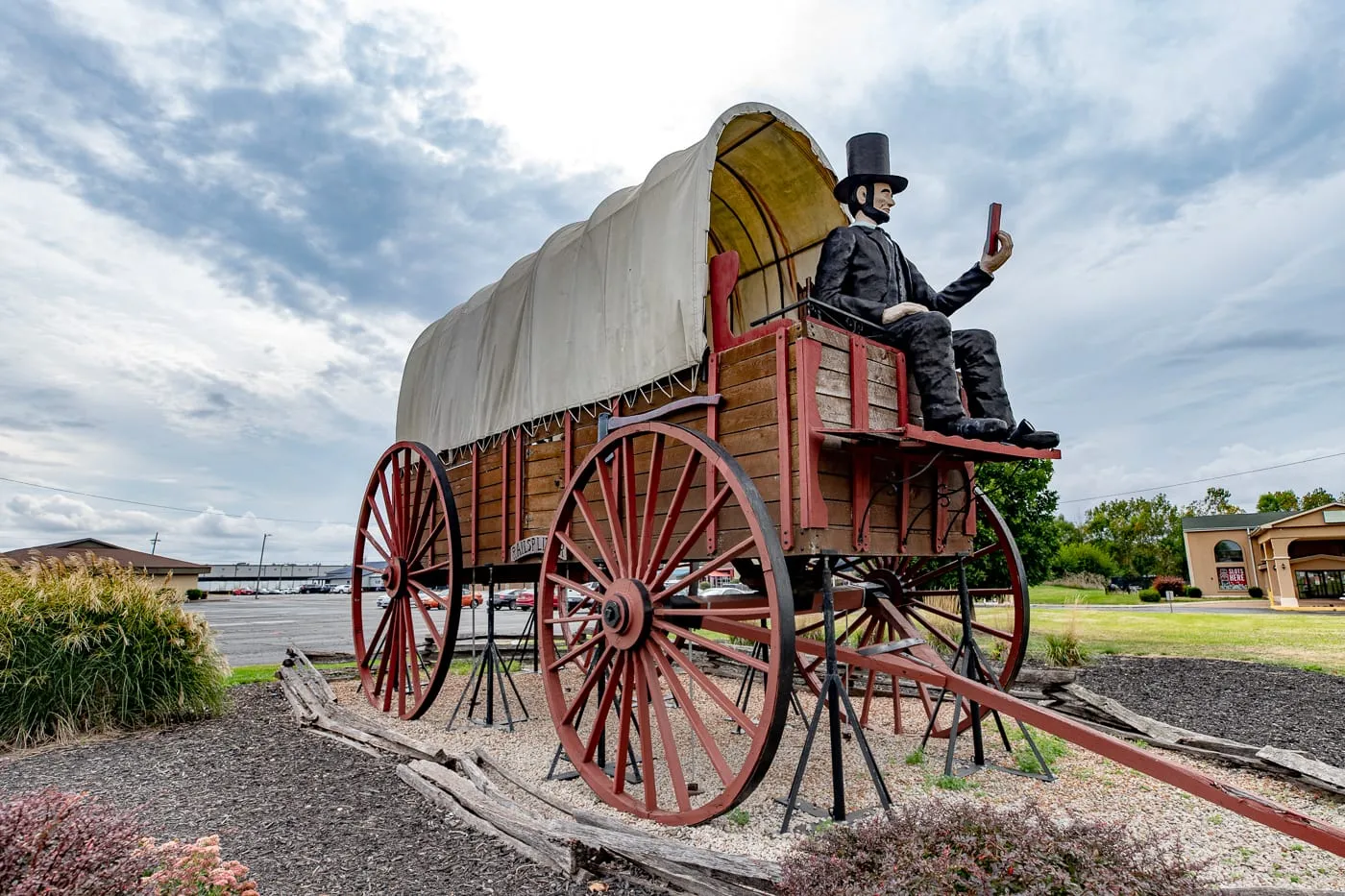 Giant Abraham Lincoln statue on the World's Largest Covered Wagon in Lincoln, Illinois Route 66 roadside attraction - Best Illinois Roadside Attractions