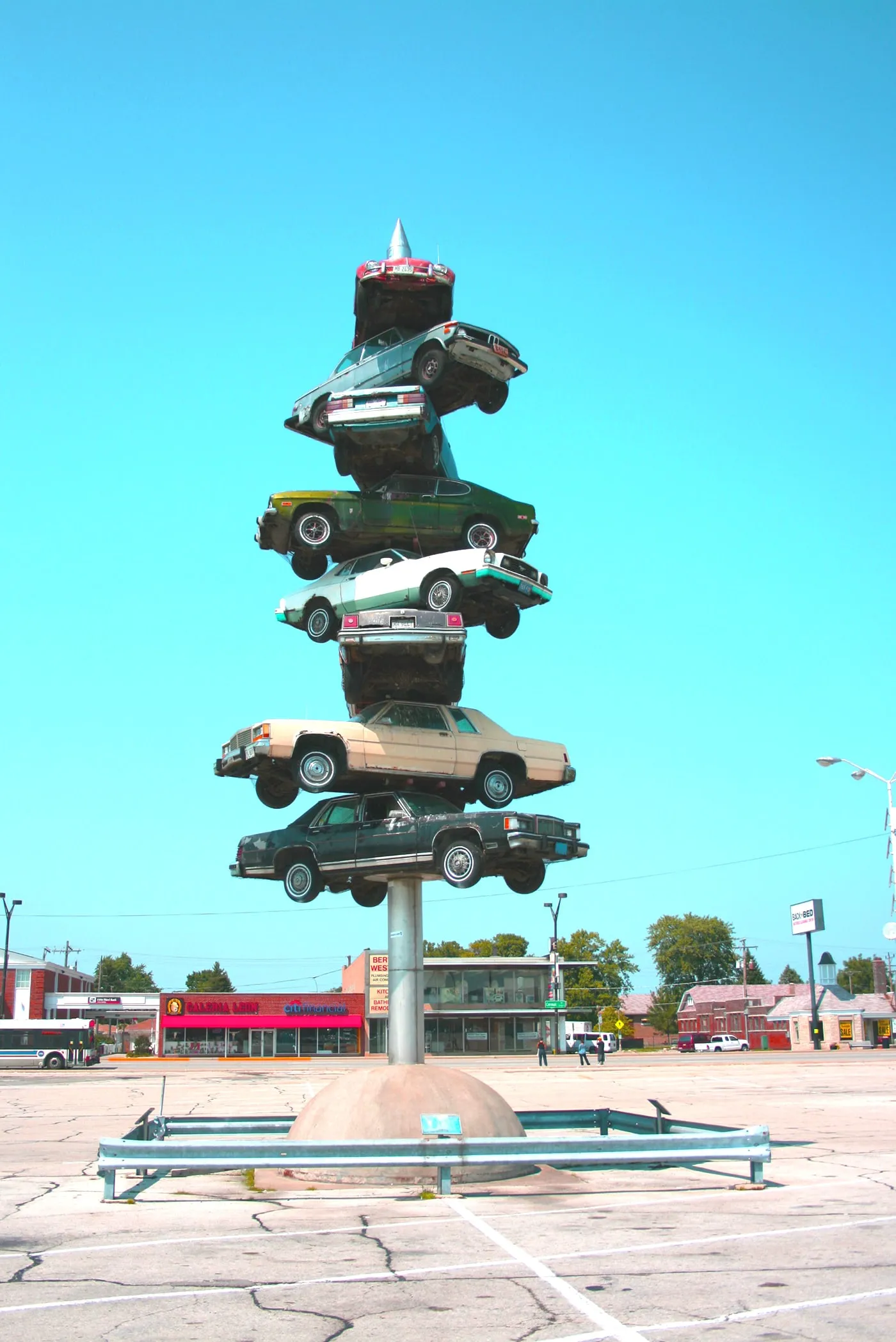 The Spindle in Berwyn, Illinois. Also known as cars on a spike or the car kabob.  This roadside attraction was torn down in 2008.