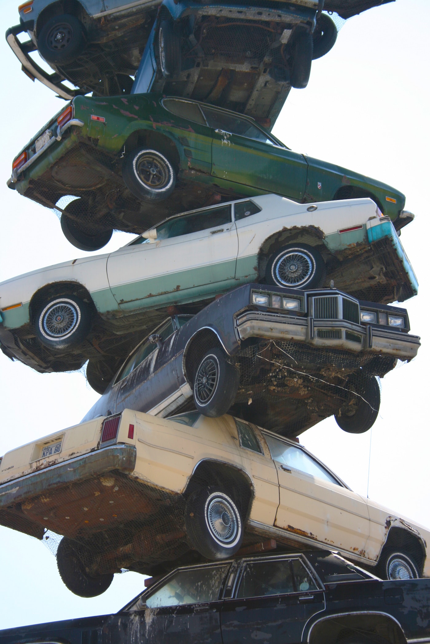 The Spindle in Berwyn, Illinois. Also known as cars on a spike or the car kabob.  This roadside attraction was torn down in 2008.