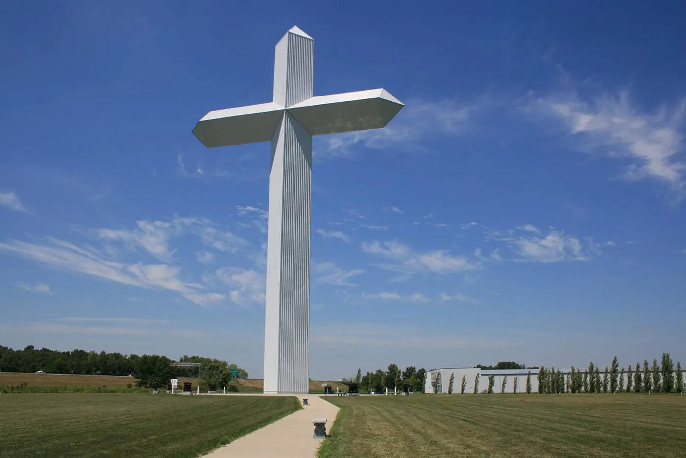 Best Illinois roadside attractions: Cross at the Crossroads - The World's Largest Cross in Effingham, Illinois. Visit this roadside attraction on an Illinois road trip with kids or weekend getaway with friends. Add the Cross at the Crossroads  to your road trip bucket list and visit them on your next travel adventure.