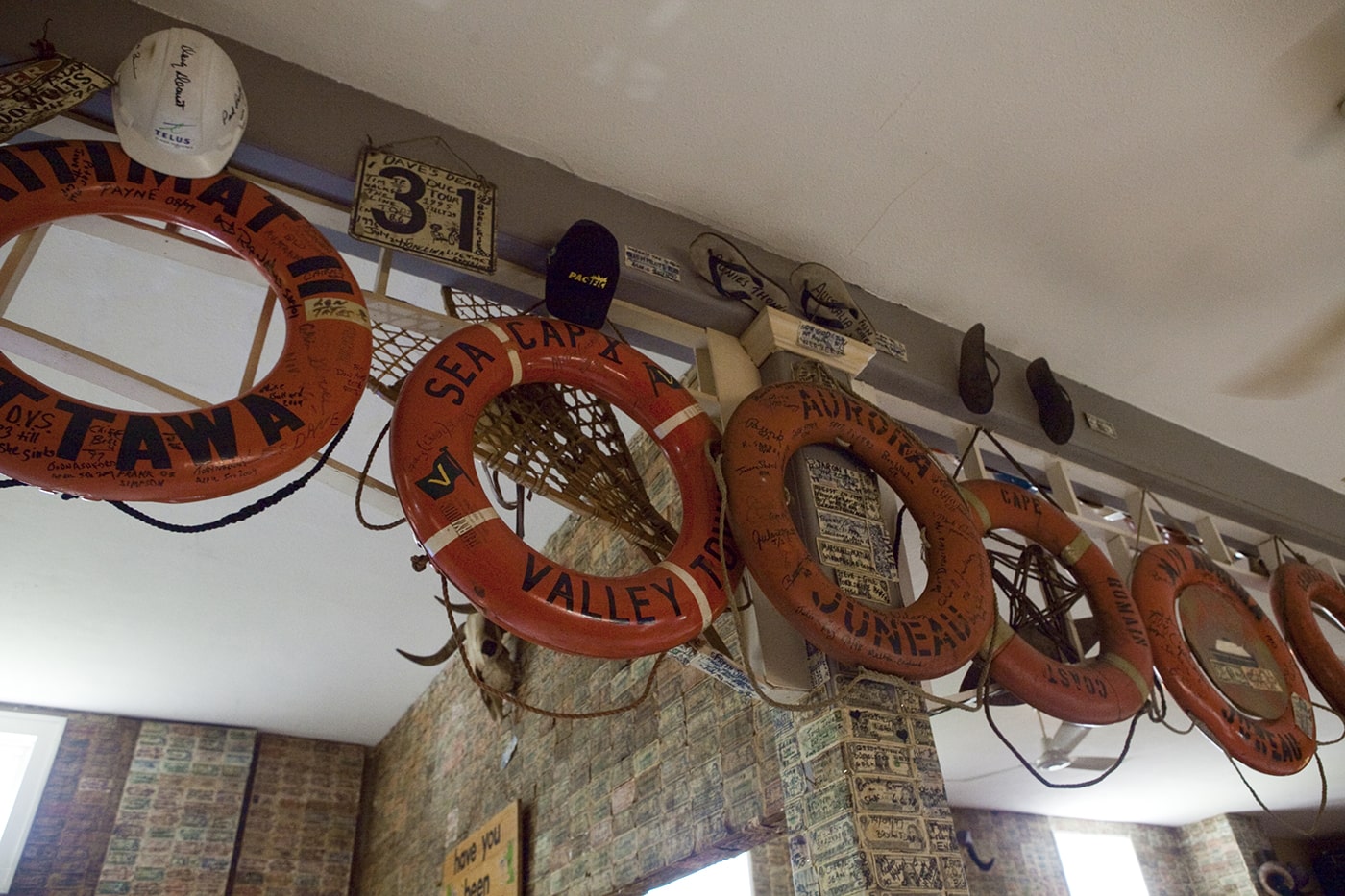 Life preservers hang on the walls of the Glacier Inn in Hyder, Alaska.