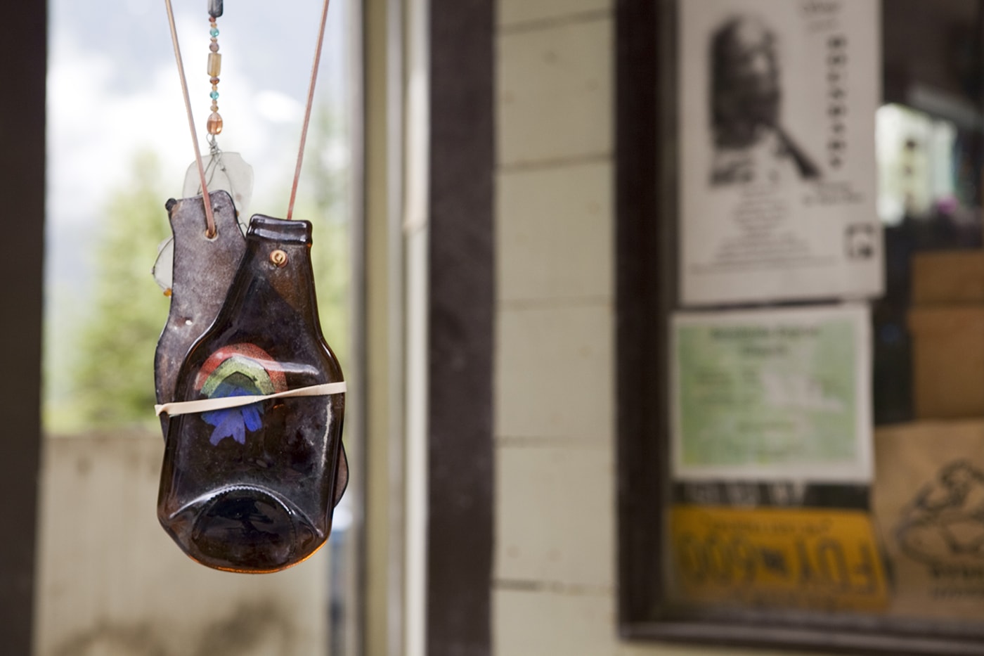 Hanging bottle wind chimes on the porch of a fudge shop in Hyder, Alaska.