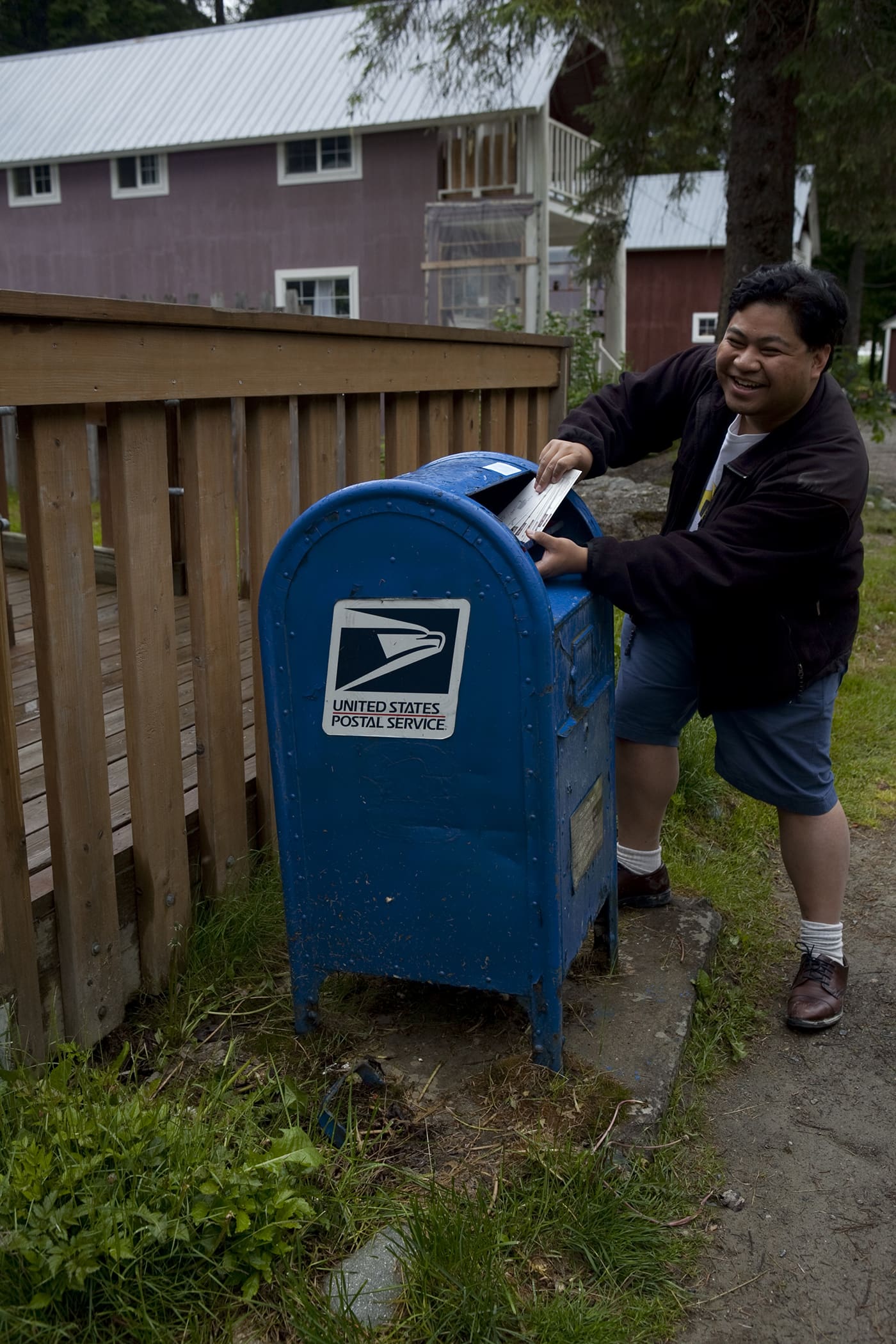 Mailing postcards at the Hyder, Alaska Post Office.