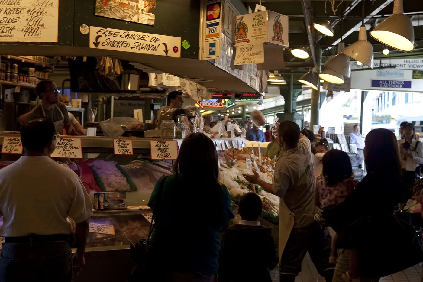 Fishmongers throwing fish at Pike Place Fish Market in Seattle, Washington.