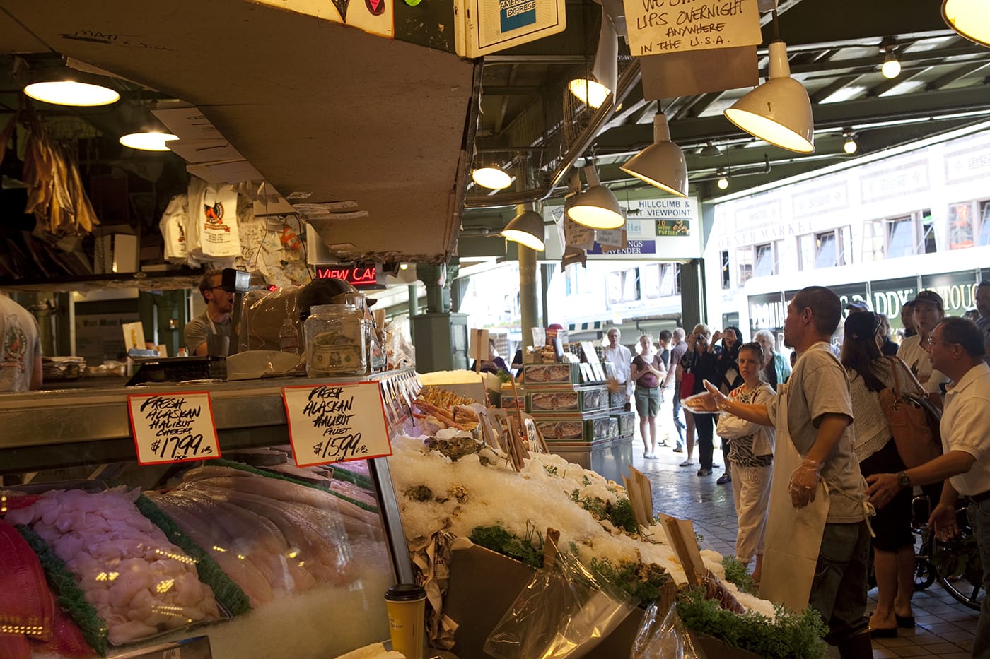 Fishmongers throwing fish at Pike Place Fish Market in Seattle, Washington.