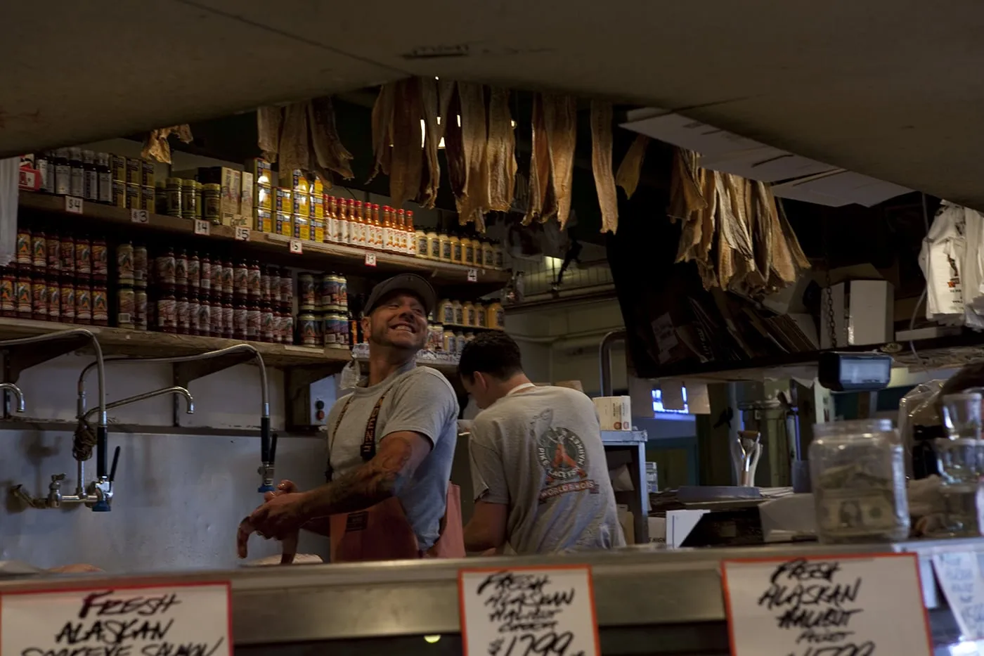 Fishmongers throwing fish at Pike Place Fish Market in Seattle, Washington.