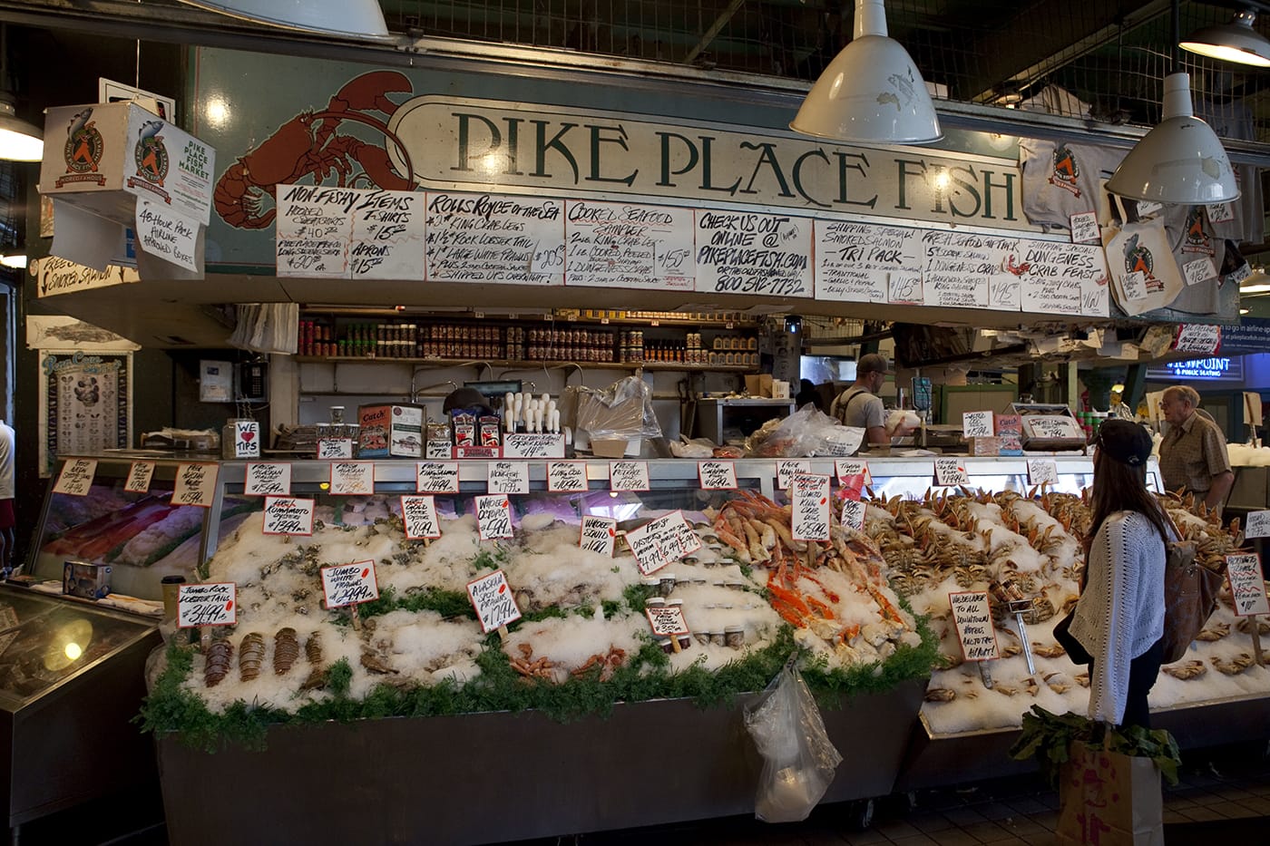 Fishmongers throwing fish at Pike Place Fish Market in Seattle, Washington.