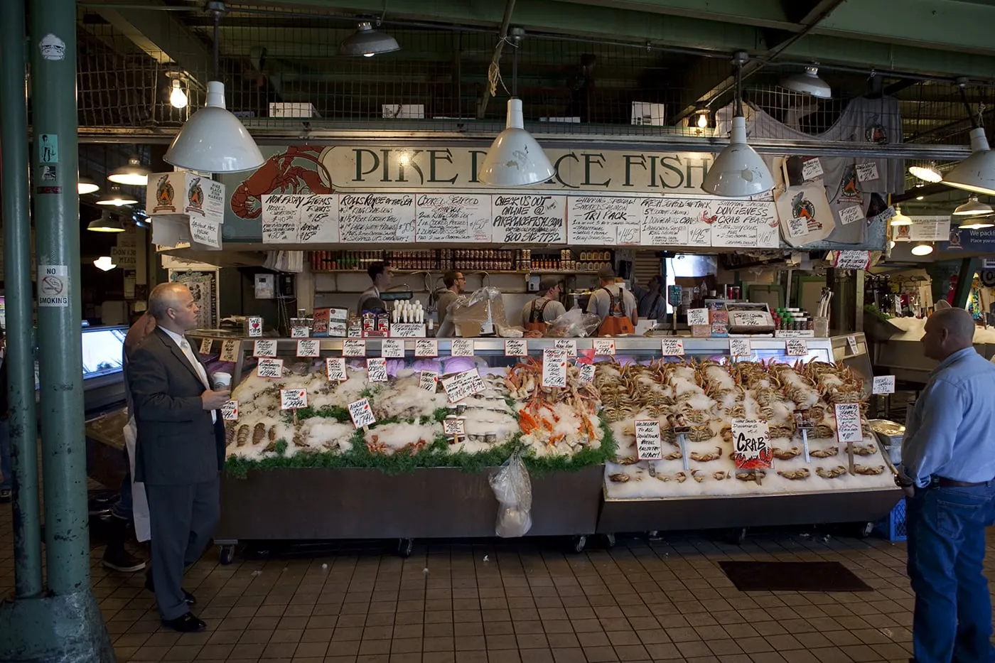 Fishmongers throwing fish at Pike Place Fish Market in Seattle, Washington.