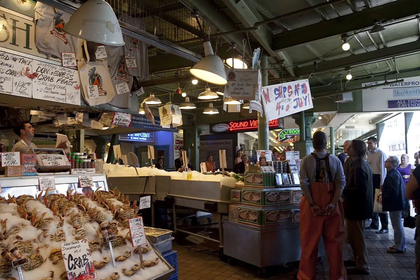 Fishmongers throwing fish at Pike Place Fish Market in Seattle, Washington.