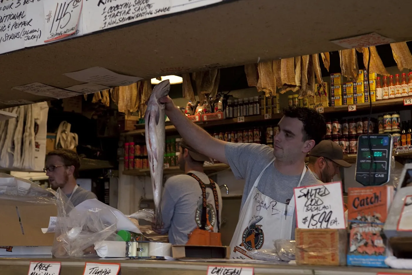 Fishmongers throwing fish at Pike Place Fish Market in Seattle, Washington.