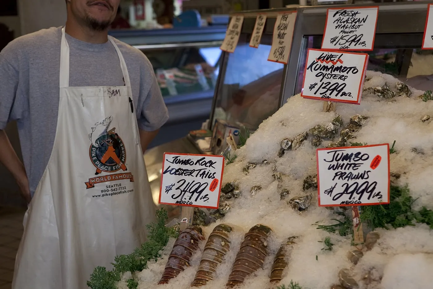 Fishmongers throwing fish at Pike Place Fish Market in Seattle, Washington.