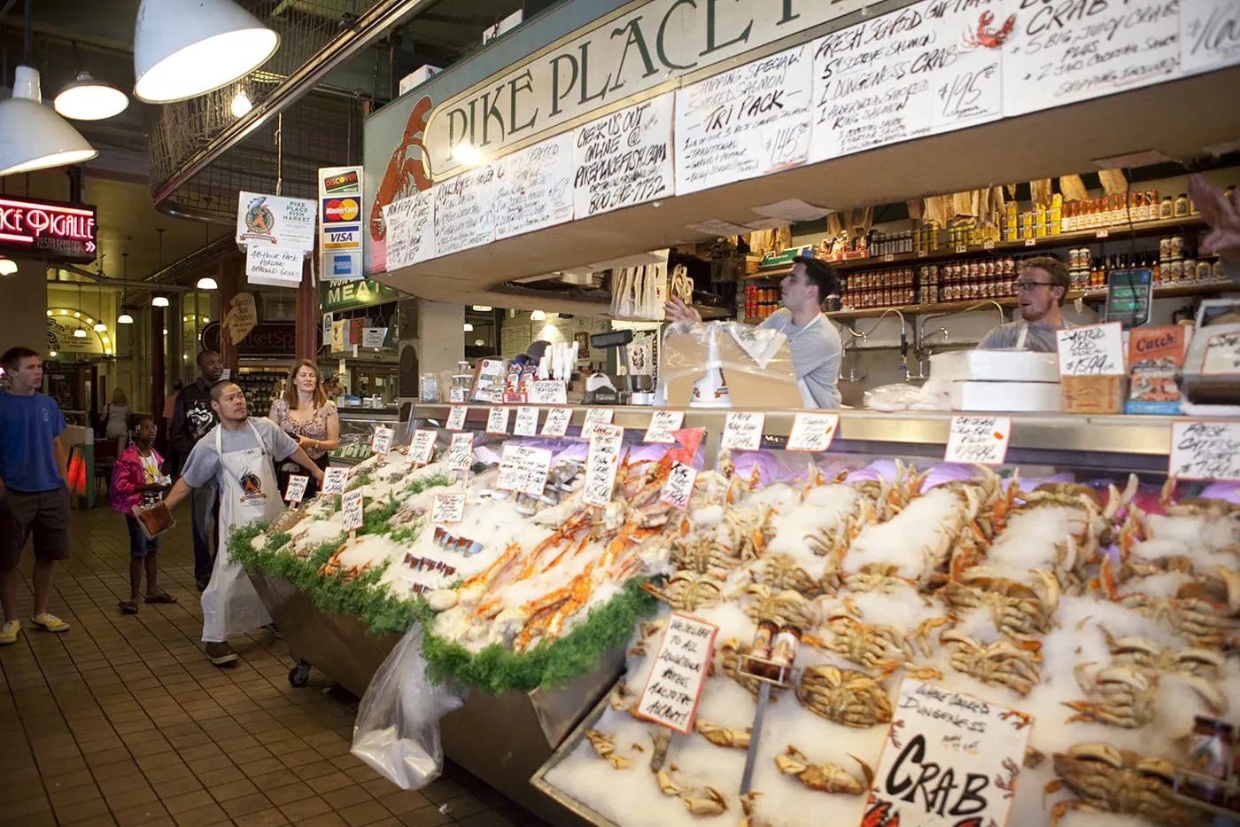 Fishmongers throwing fish at Pike Place Fish Market in Seattle, Washington.