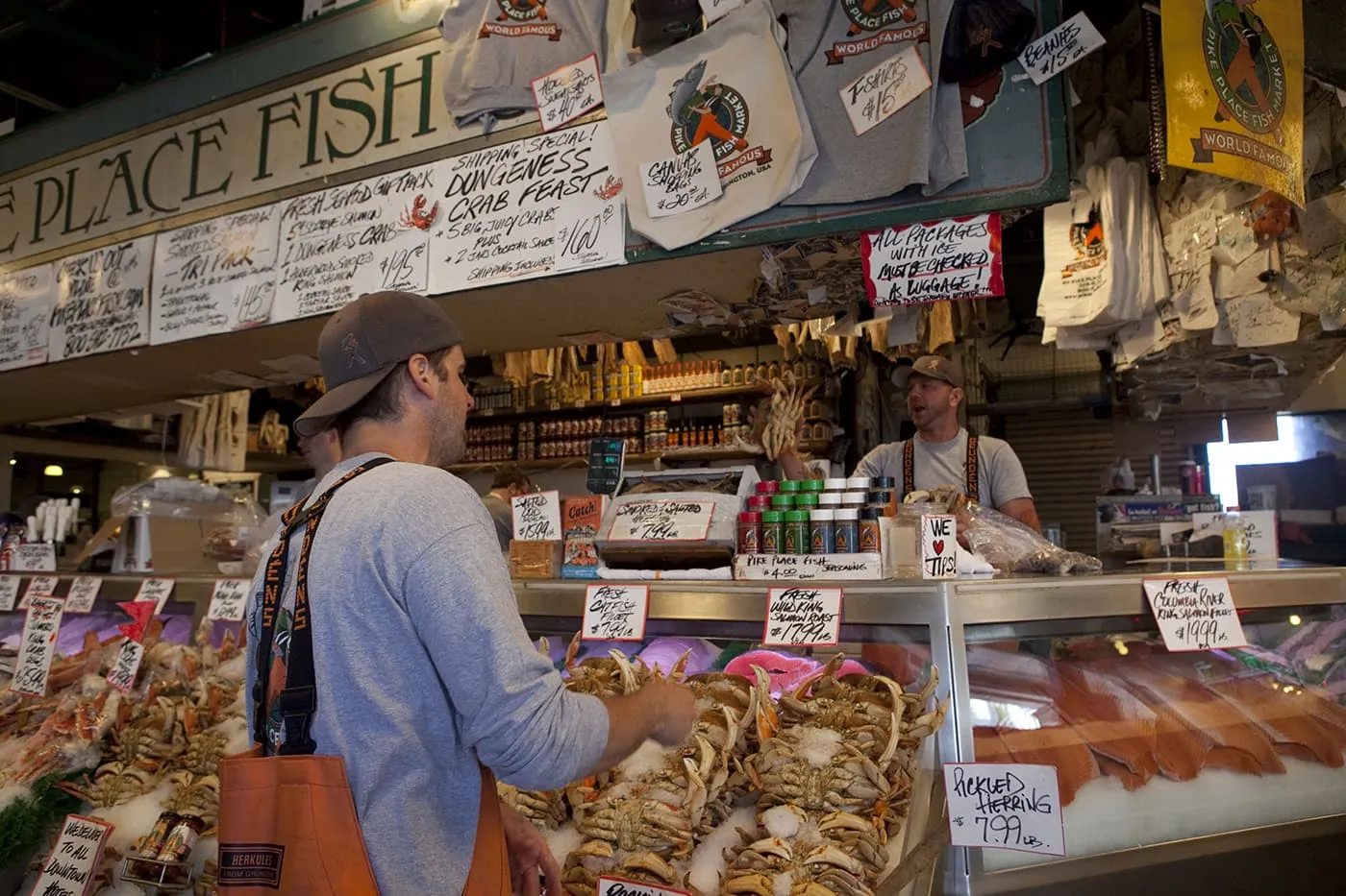 Fishmongers throwing fish at Pike Place Fish Market in Seattle, Washington.