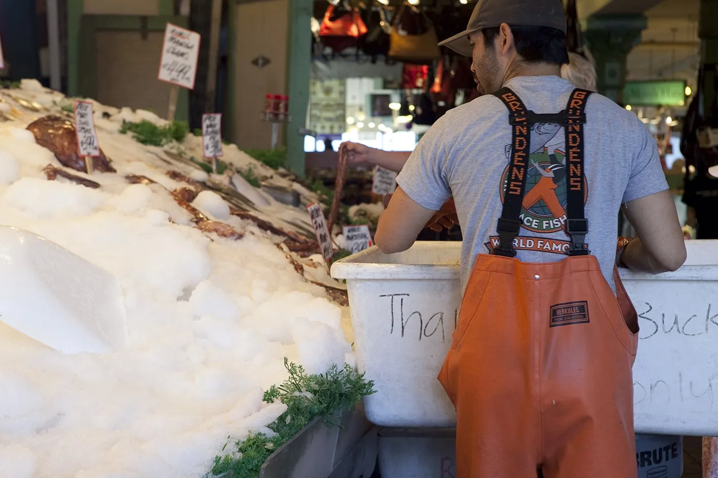 Fishmongers throwing fish at Pike Place Fish Market in Seattle, Washington.