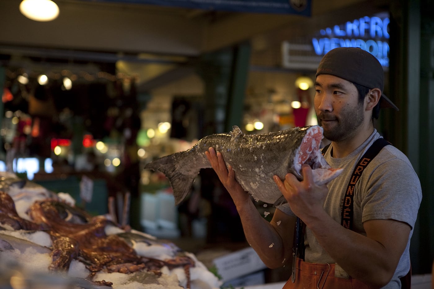 Fishmongers throwing fish at Pike Place Fish Market in Seattle, Washington.