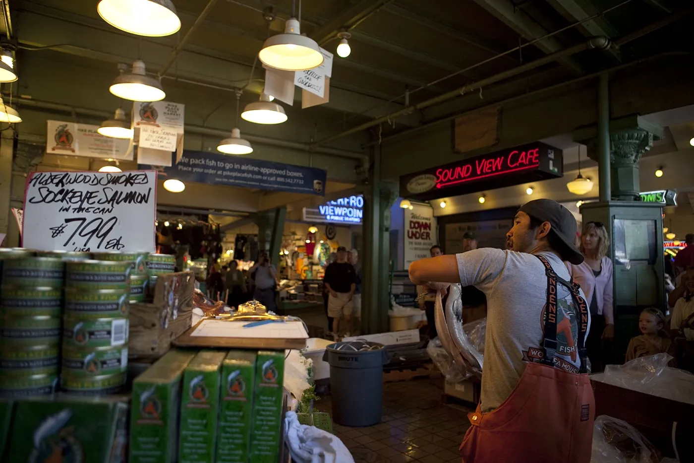 Fishmongers throwing fish at Pike Place Fish Market in Seattle, Washington.