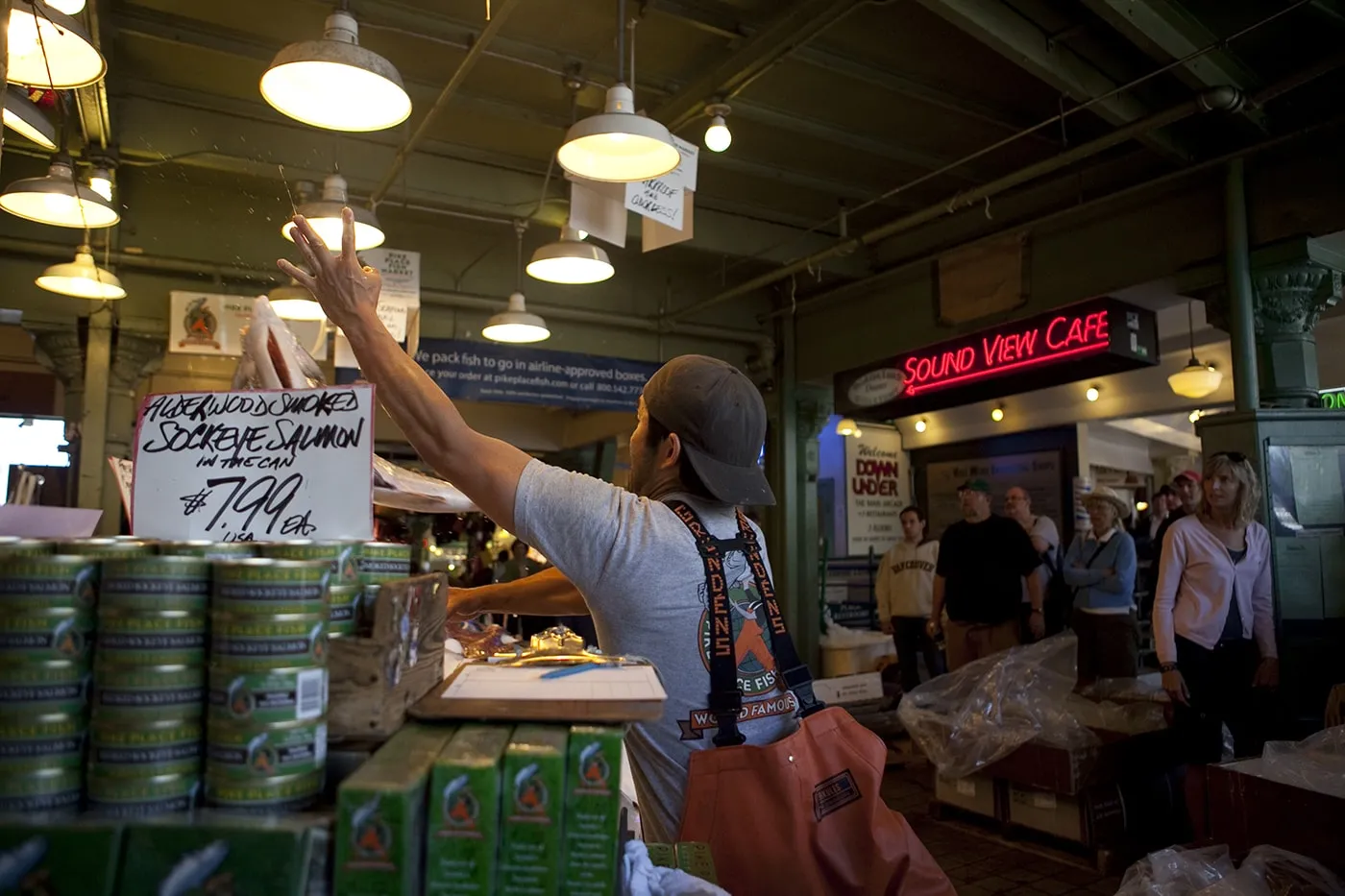 Fishmongers throwing fish at Pike Place Fish Market in Seattle, Washington.