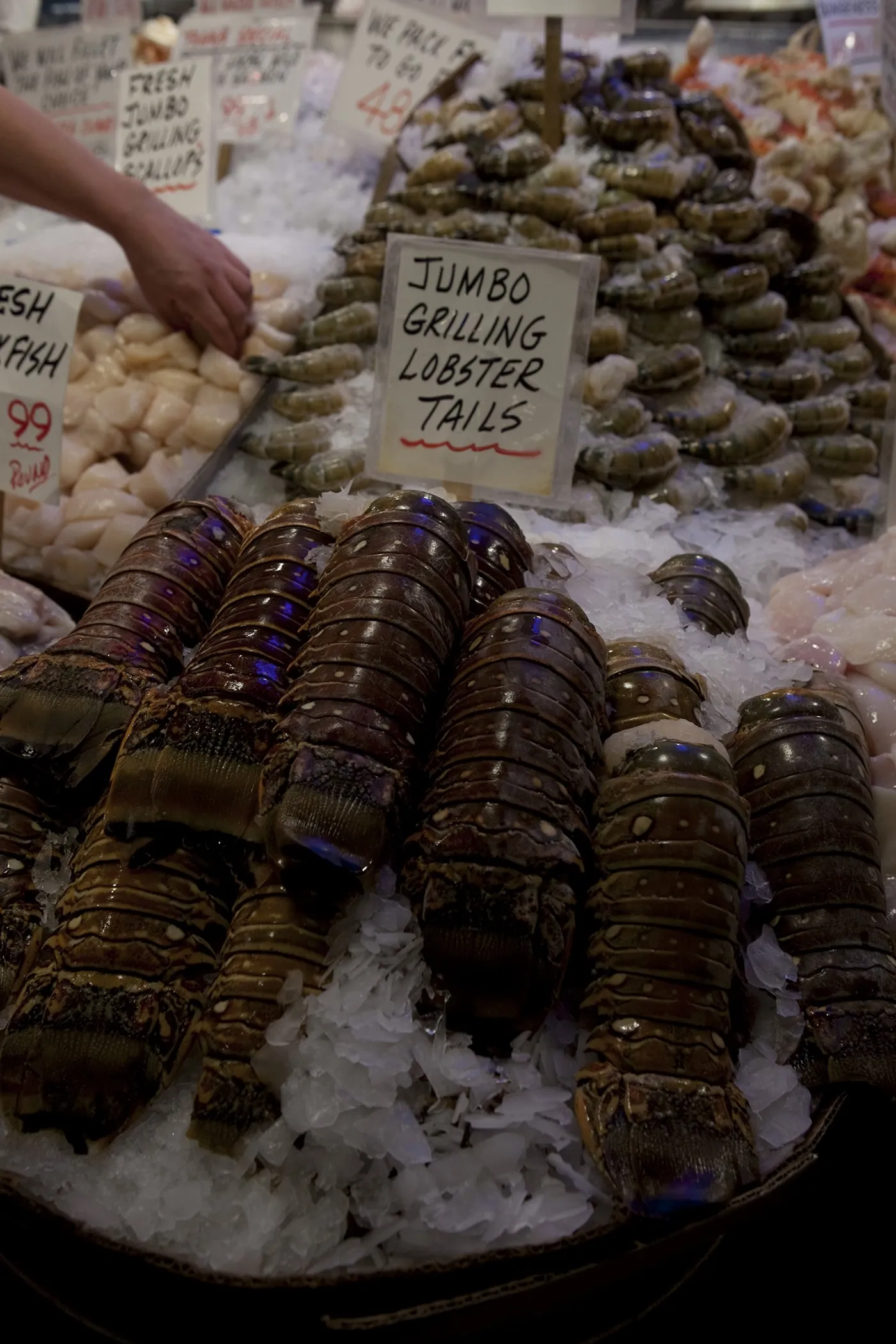 Jumbo grilling lobster tails for sale at Pike Place Market in Seattle, Washington.