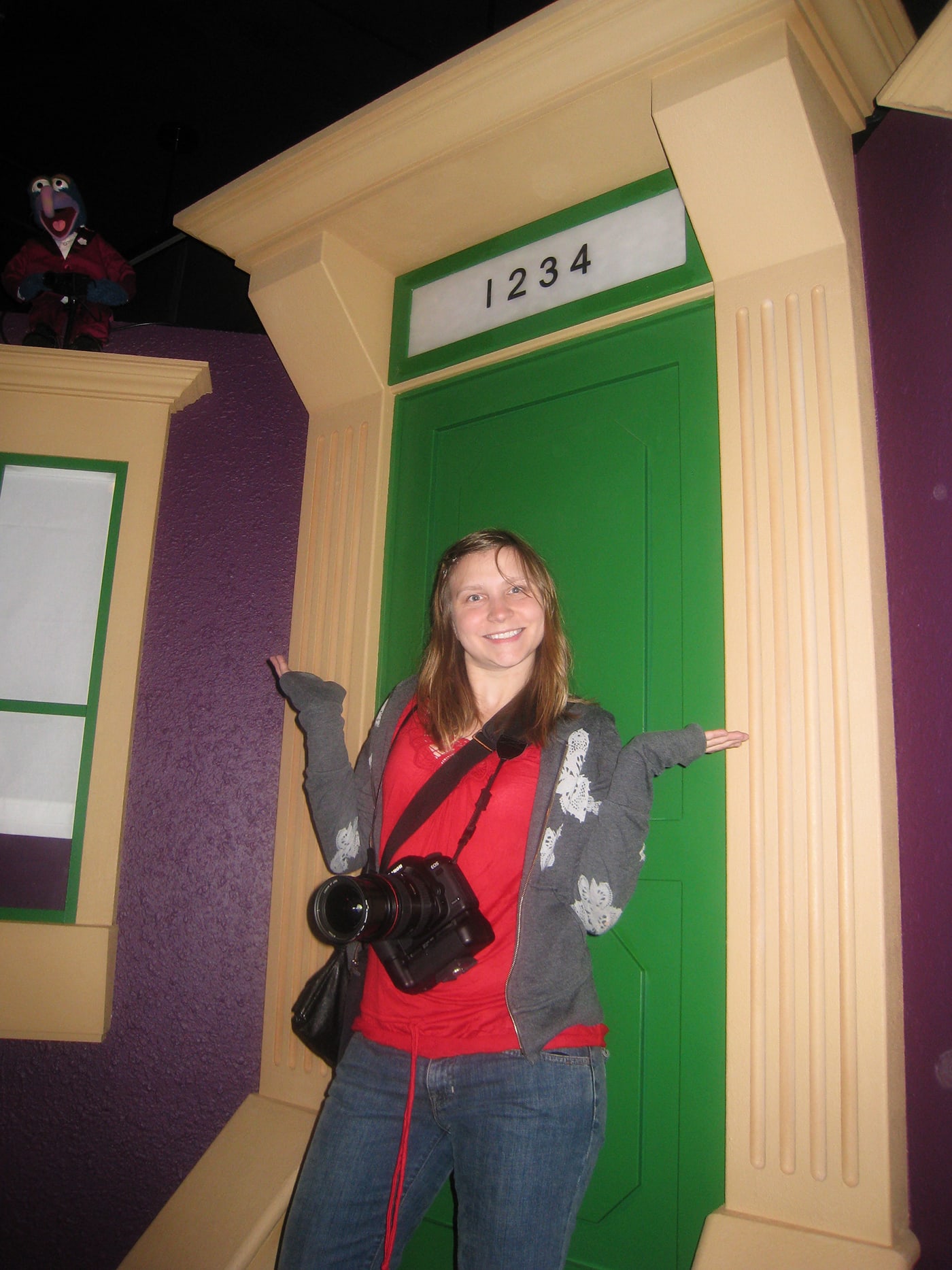 Val in front of a Sesame Street door at the Jim Henson's Fantastic World exhibit at the Experience Music Project/Science Fiction Museum in Seattle, Washington.