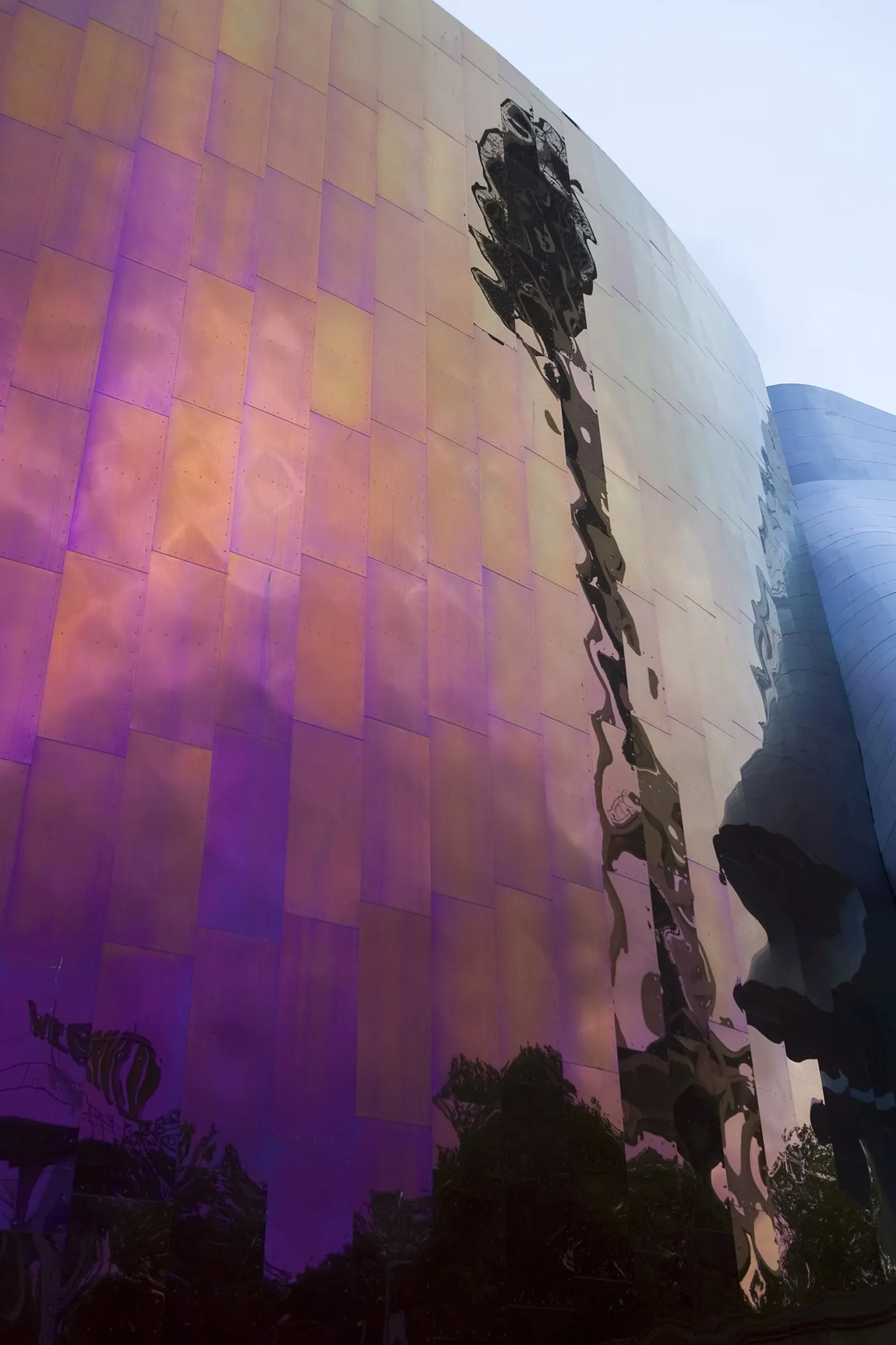 The Space Needle reflected off of off of Experience Music Project in Seattle, Washington.