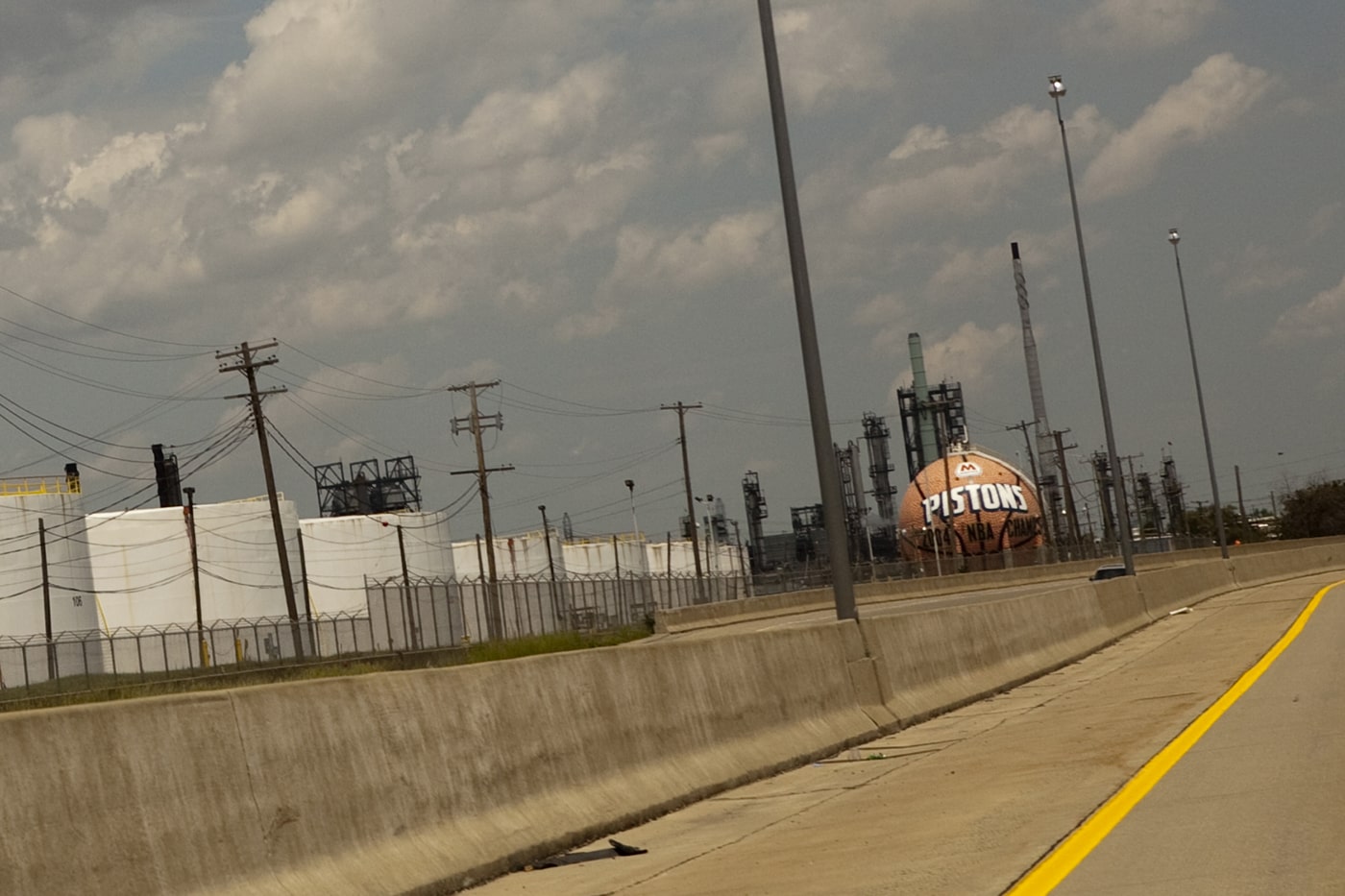 Giant basketball painted with the Detroit Pistons and WNBA Detroit Shock team logos, outside of Detroit, Michigan.