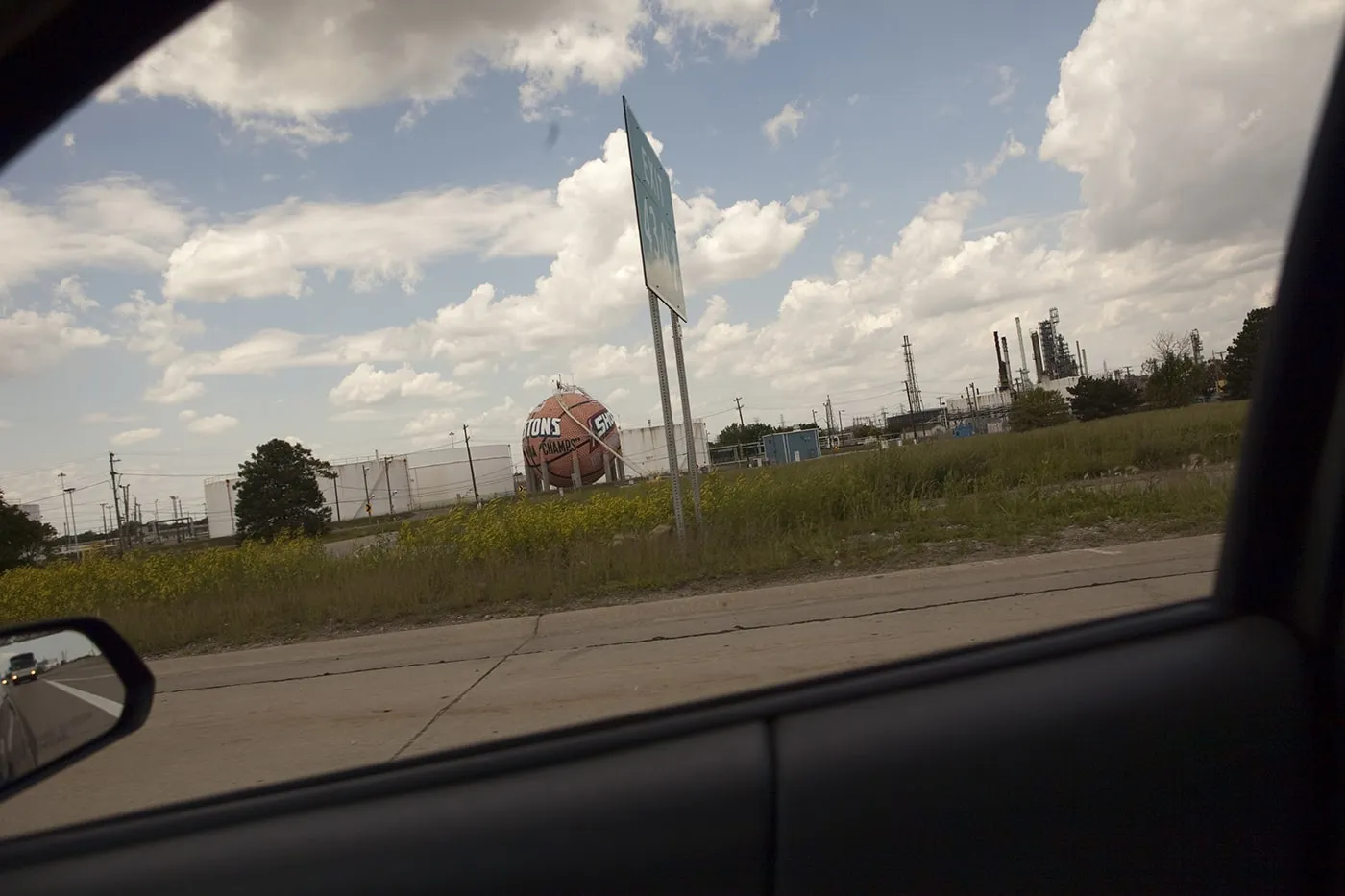 Giant basketball painted with the Detroit Pistons and WNBA Detroit Shock team logos, outside of Detroit, Michigan.