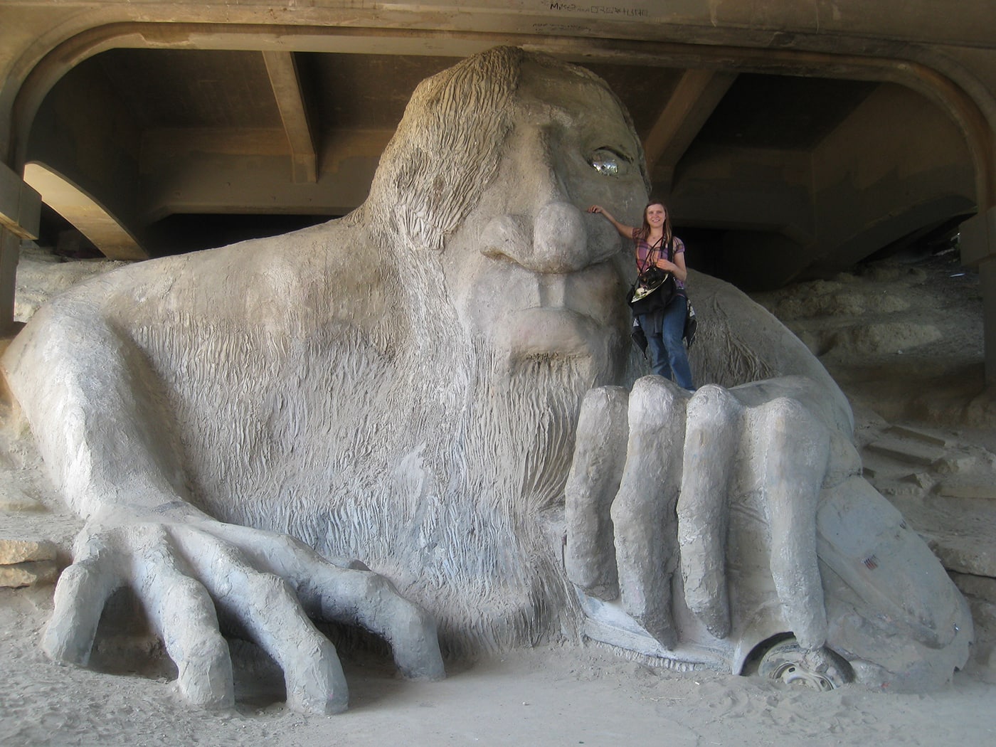 Val and the Fremont Troll, a roadside attraction in Seattle, Washington.