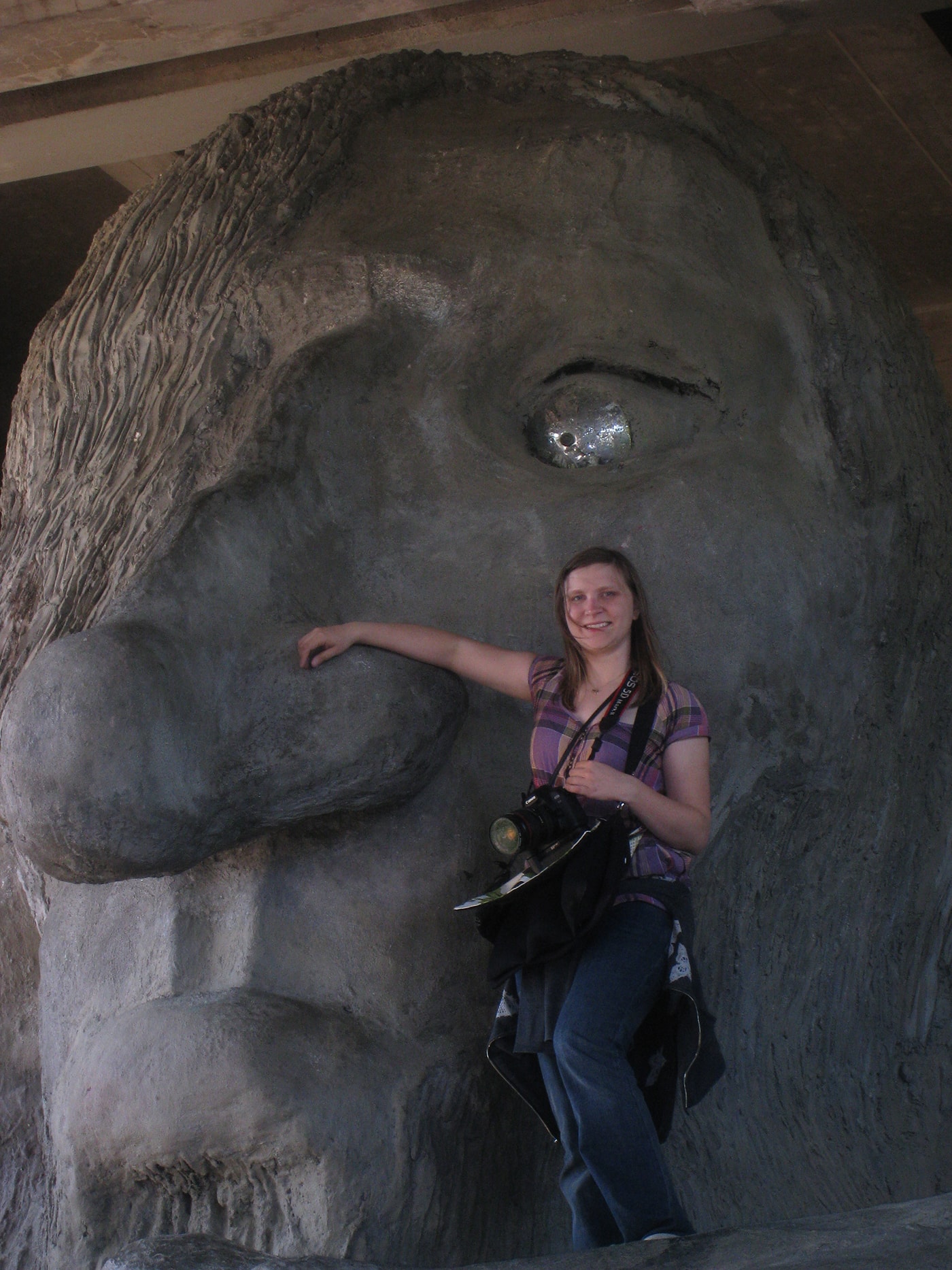 Val and the Fremont Troll, a roadside attraction in Seattle, Washington.