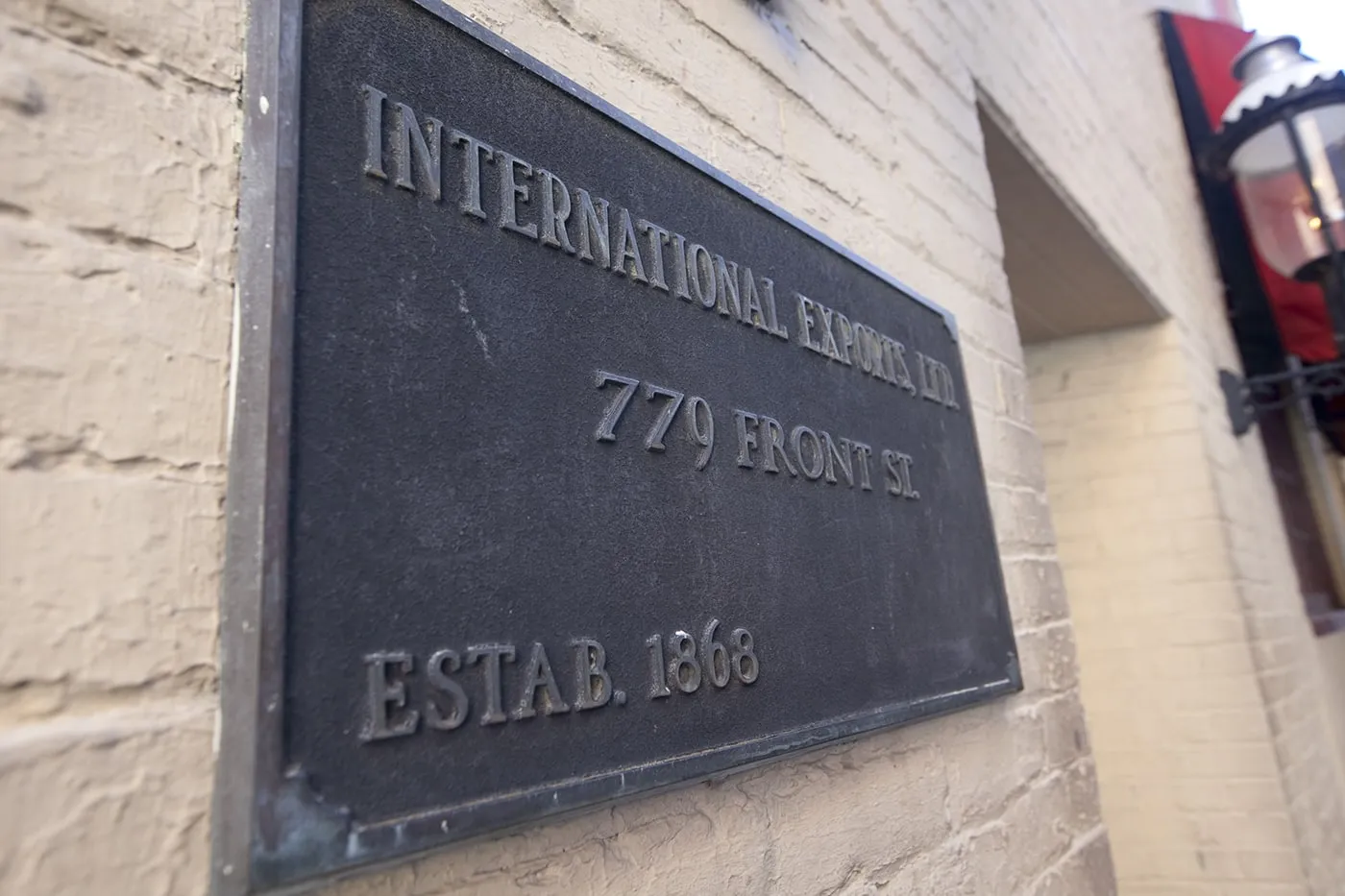 International Exports Ltd sign outside of the Safe House, a spy-themed restaurant in Milwaukee, Wisconsin.