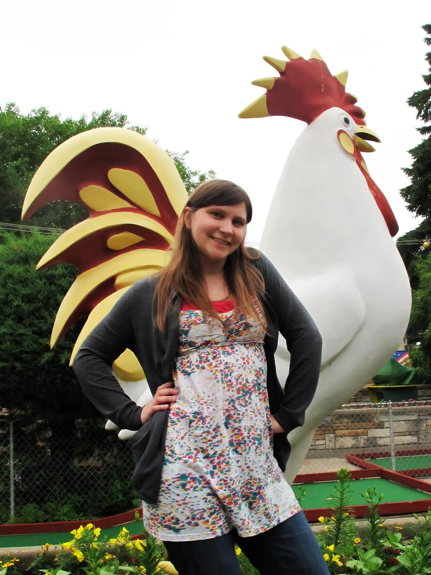 Val and a rooster at Novelty Golf in Lincolnwood, Illinois.
