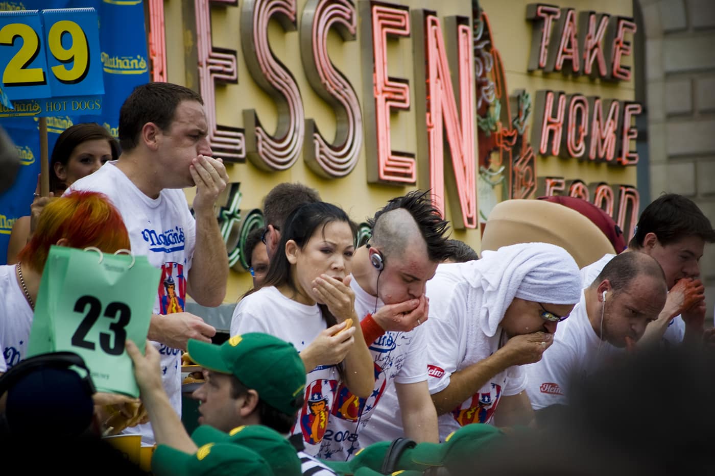 Competitive eaters eat at Coney Island in the Nathan's Famous hot dog eating contest every Fourth of July