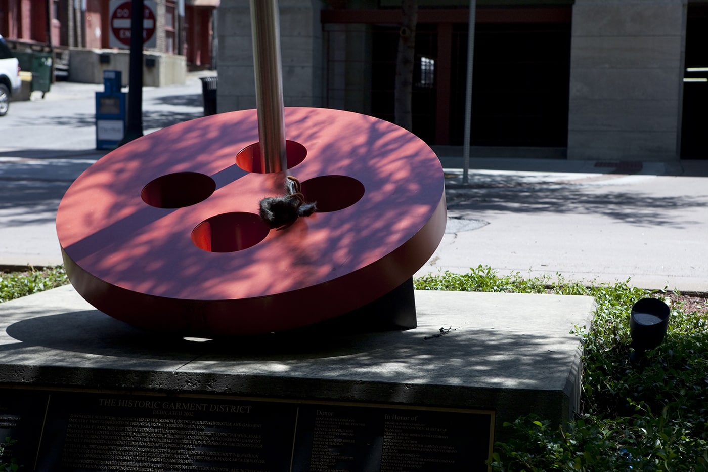 Giant needle threading a button in Kansas City, Missouri