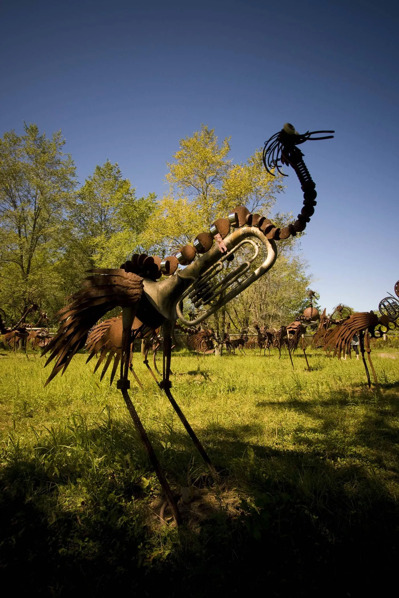 Scrap metal bird made from musical instruments. The world's largest scrap metal sculpture, Dr. Evermor's Forevertron at Delaney's Surplus Sales in Sumpter, Wisconsin, is meant for intergalactic travel. Visit this weird roadside attraction on a Wisconsin road trip.
