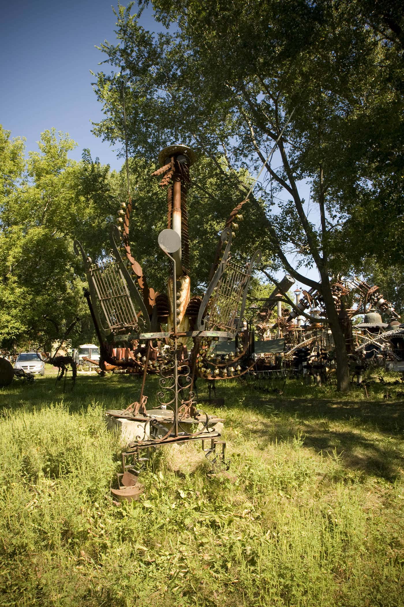 Scrap metal bird made from musical instruments. The world's largest scrap metal sculpture, Dr. Evermor's Forevertron at Delaney's Surplus Sales in Sumpter, Wisconsin, is meant for intergalactic travel. Visit this weird roadside attraction on a Wisconsin road trip.