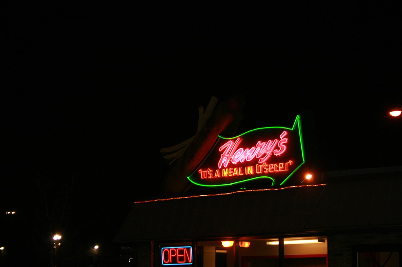 Giant Hot Dog Topped with Fries at Henry's Drive-In in Cicero, Illinois | Henry's Drive-In is a Route 66 institution, having served fast-food fare to hungry travelers since the 1950s. Check out the giant hot dog topped with fries!