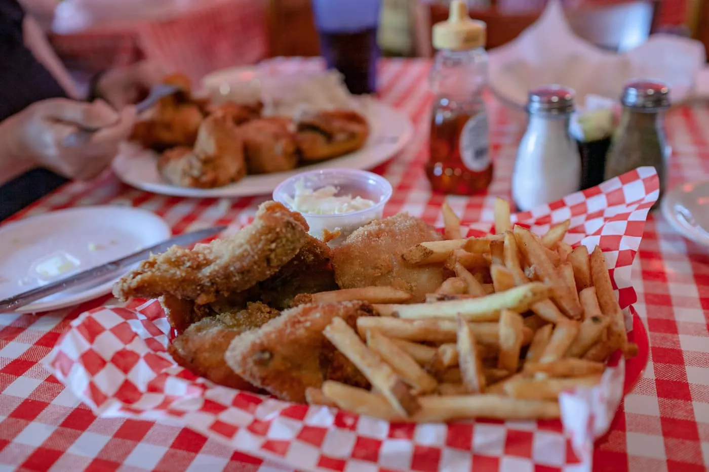 Famous Fried Chicken in a Basket - half fried chicken, French fries, homemade cole slaw and freshly baked biscuits at Dell Rhea's Chicken Basket restaurant on Route 66 in Illinois.