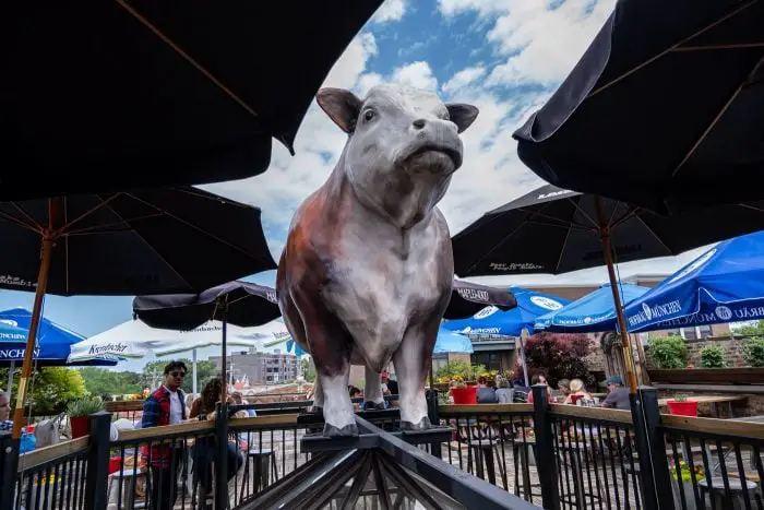 Gene's Sausage Shop rooftop cow. Giant cow statue in Lincoln Square, Chicago, Illinois.