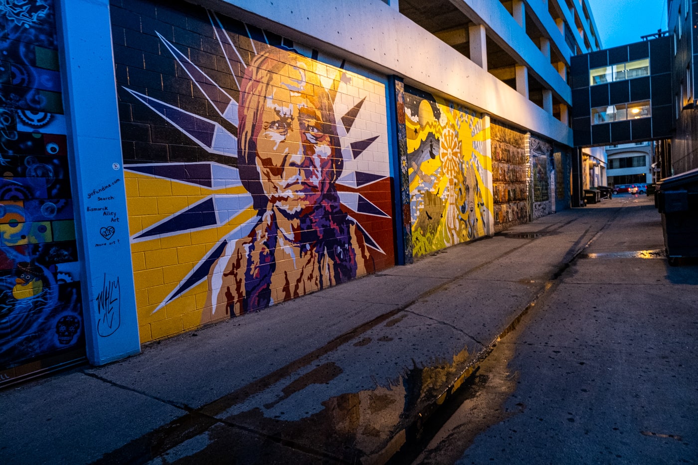 Portrait of Sitting Bull in the style of Warhol by artist Melissa Gordon. Alley 5.5: Bismarck Art Alley in North Dakota - Street art and Murals in Bismarck, North Dakota