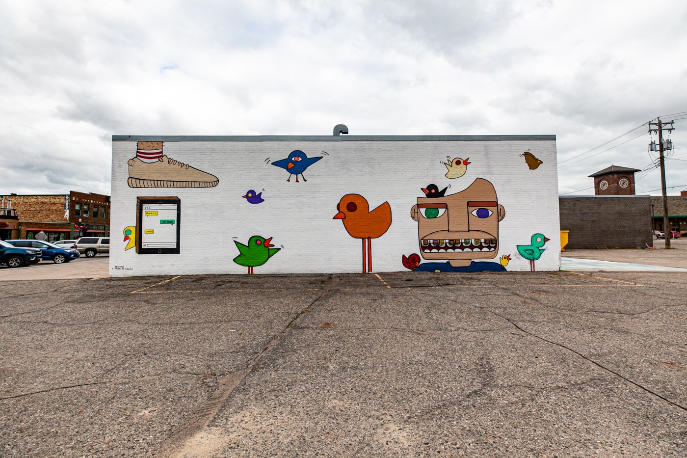 Bird Up Mural in Downtown Fargo, North Dakota by artist Hideuhs | Street Art in Fargo, North Dakota