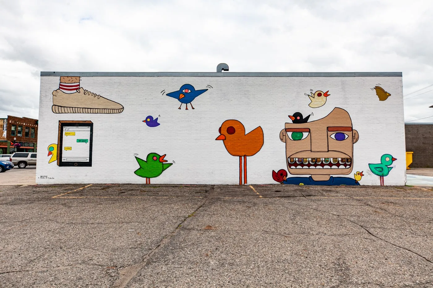 Bird Up Mural in Downtown Fargo, North Dakota by artist Hideuhs | Street Art in Fargo, North Dakota