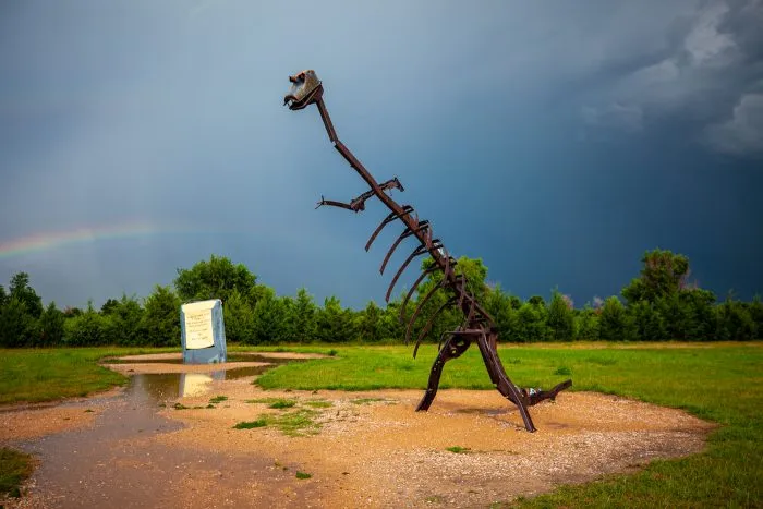 Dino dinosaur skeleton sculpture at Carhenge Roadside Attraction in Alliance, Nebraska