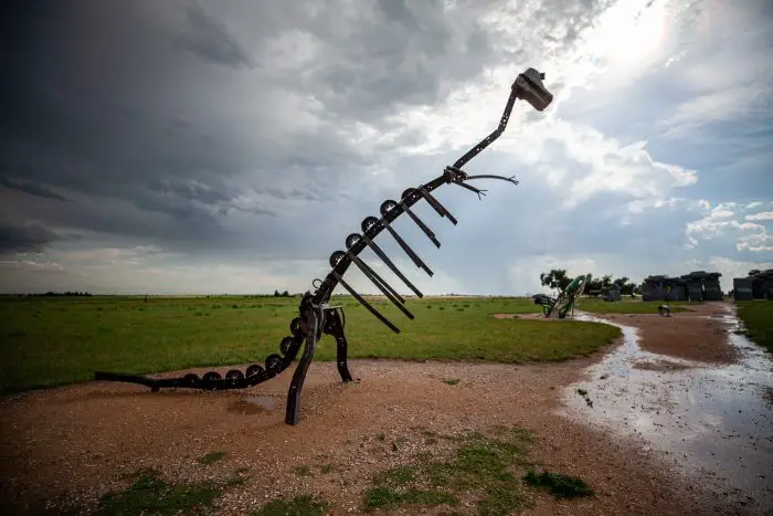 Dino dinosaur skeleton sculpture at Carhenge Roadside Attraction in Alliance, Nebraska