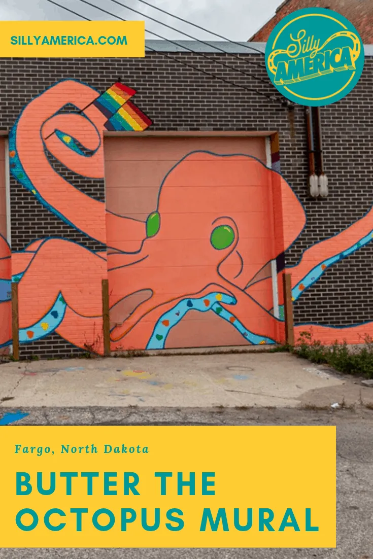 The Butter the Octopus Mural in Fargo, North Dakota, depicts a giant orange and blue octopus full of hearts and waving a rainbow flag by artist Olivia Bain. The colorful interactive street art is a fun stop on a Fargo vacation or road trip through North Dakota. It's an amazing and cool mural with a fun aesthetic.
#Murals #StreetArt #OutdoorMural, #PaintedMurals #meaningfulstreetart #streetartaesthetic #amazingstreetart #coolstreetart #colorfulstreetart #NorthDakotaTravel #FargoNorthDakota