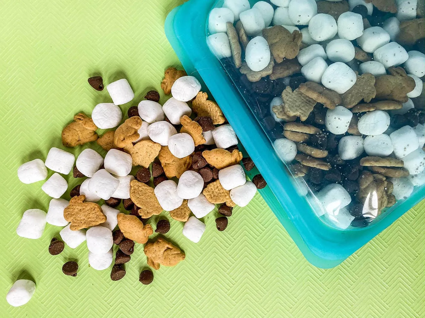 This s'mores snack mix recipe takes all the components of that camping staple we all know and love and puts it into an easy-to-eat-on-the-go package with teddy grahams, chocolate chips, marshmallows, and smoked sugar.