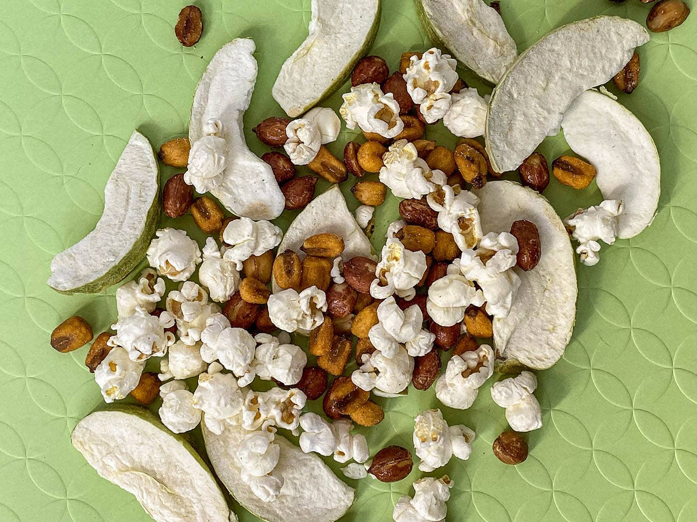 What Illinois road trip snacks should you pack for your road trip and what's in an Illinois snack mix recipe? Try these official state snacks like popcorn, corn, beer nuts, and apples.