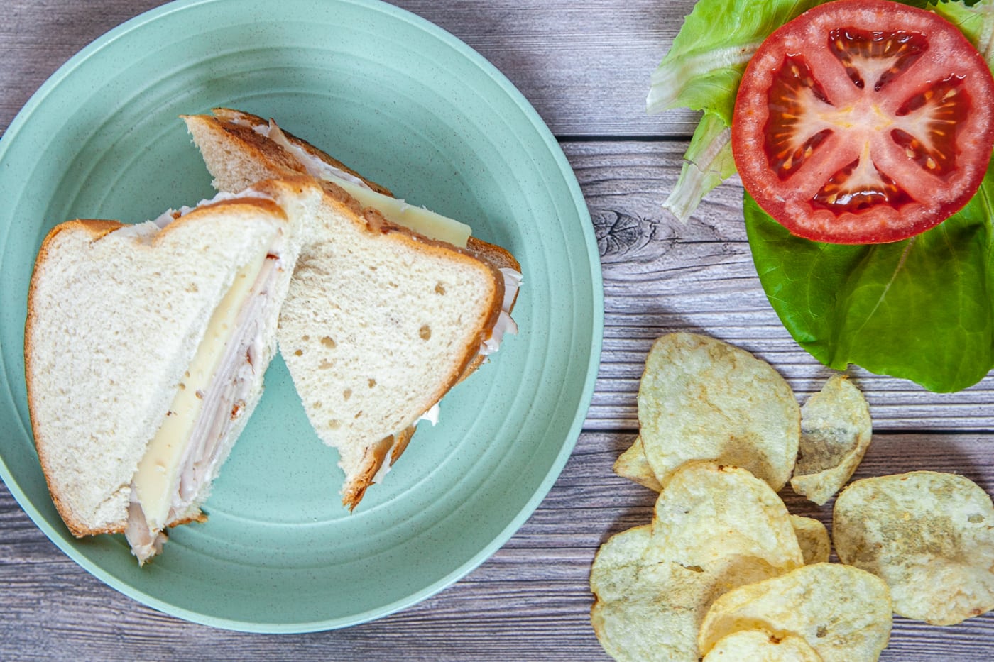 Road trip sandwiches - turkey and Swiss cheese sandwich on white bread.