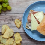 Road trip sandwiches - prosciutto, Manchego cheese, and fig jam sandwich on cheese sandwich on a ciabatta roll.