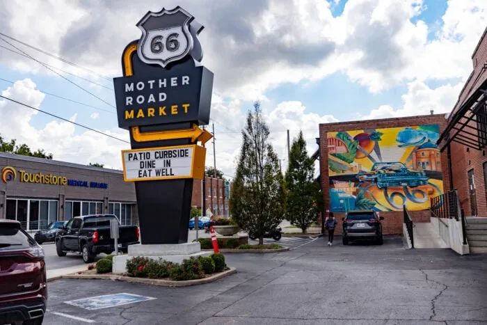 Mother Road Market neon sign and Route 66 mural in Tulsa, Oklahoma.