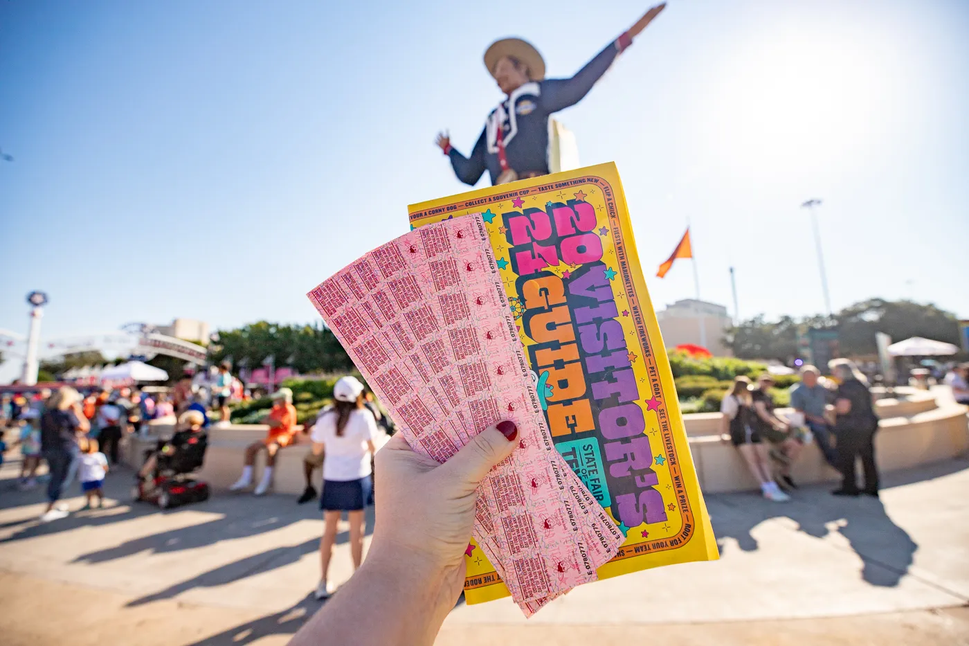 Food tickets at The State Fair of Texas with Big Tex in the background