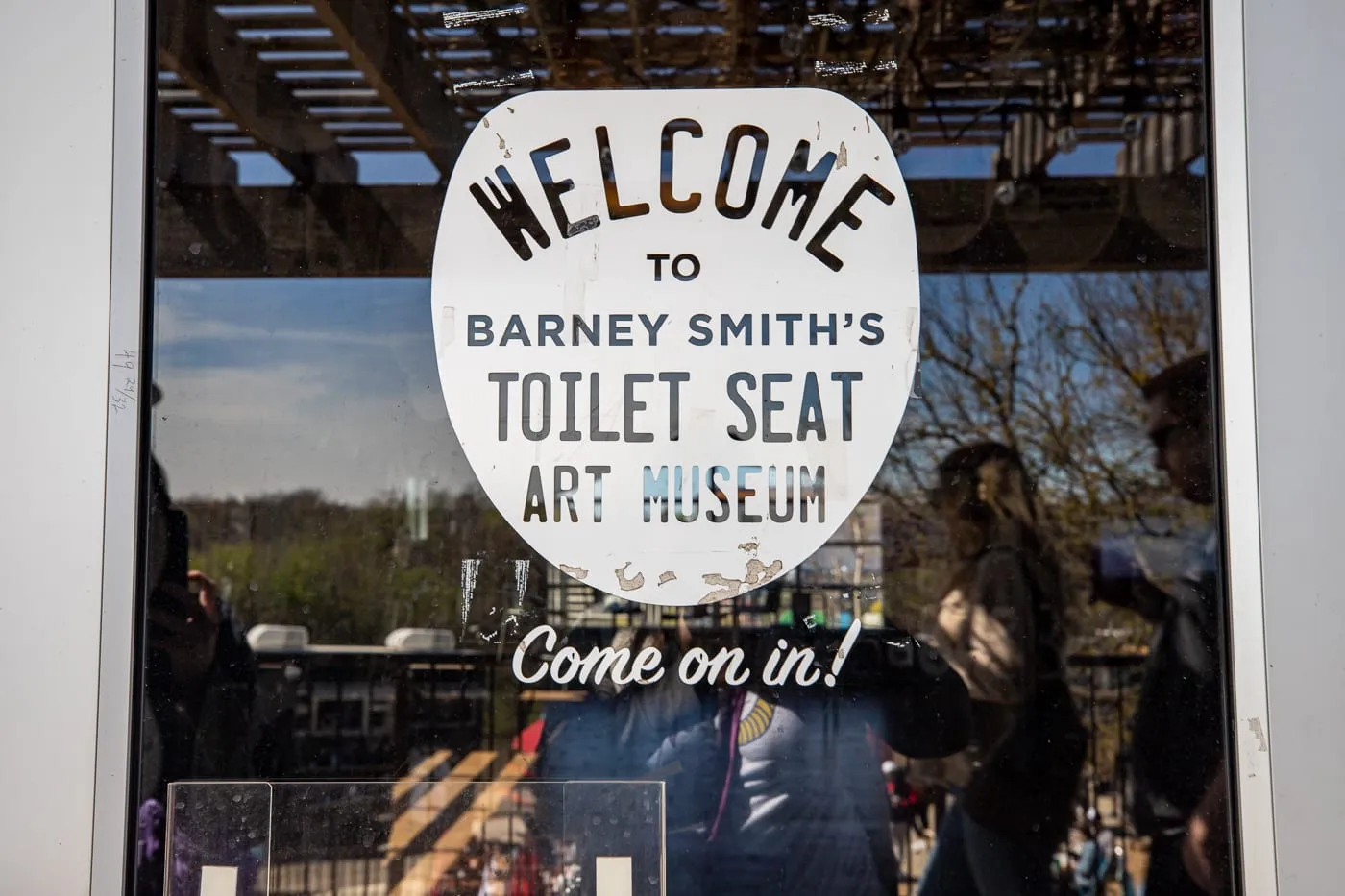 Welcome sign on door - Barney Smith's Toilet Seat Art Museum in The Colony, Texas at The Truck Yard Bar